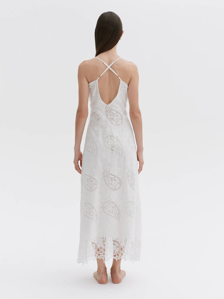 A breezy chantilly dream dress with a hand-drawn paisley pattern translated into broderie anglaise, crossover straps and rose gold detail. Collagerie.com