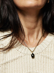 Gold and black enamel egg necklace