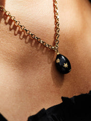 Gold and black enamel egg necklace