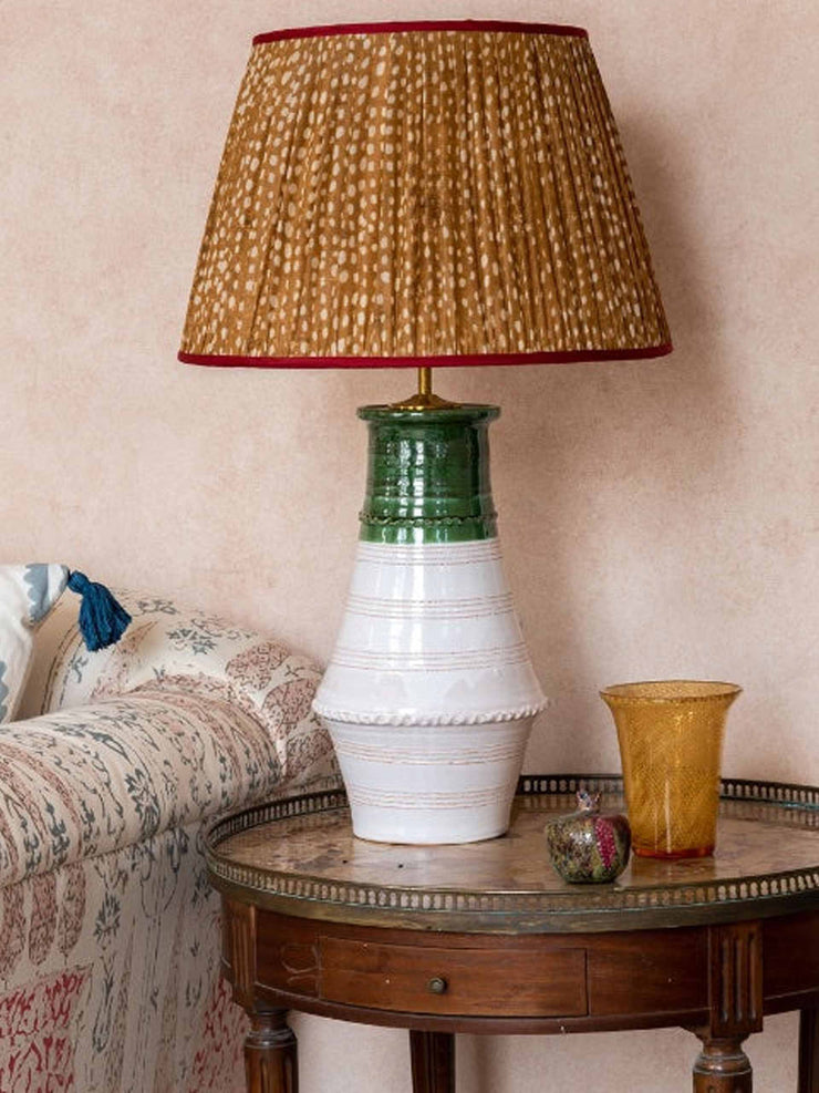 Brown and white spotted pleated silk lampshade with red trim