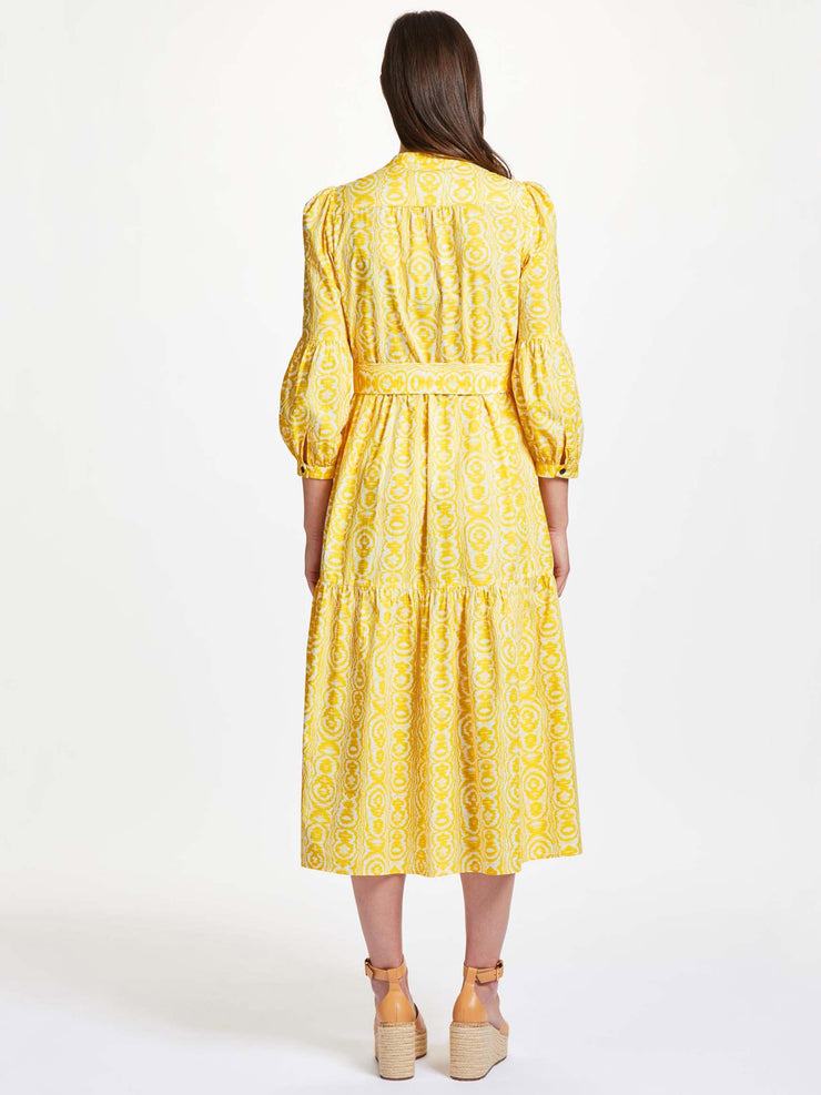 The yellow moire print Alice dress by Rae Feather. Made from organic cotton-poplin making it ideal for summer. Comes with detachable sash belt | Collagerie.com