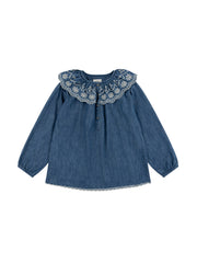 Featuring a statement collar, this versatile, denim Seventy + Mochi blouse is the perfect transitional piece. Layer under jumpers and jackets, or on its own. Collagerie.com