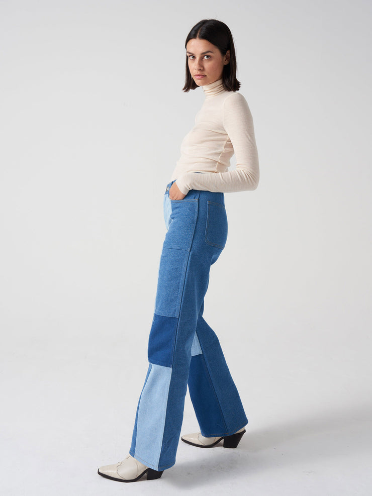 Vintage inspired patched blue jean by Seventy + Mochi. Perfect transitional fall piece. Fitted at the hips and thigh and very slightly flared at the hem.