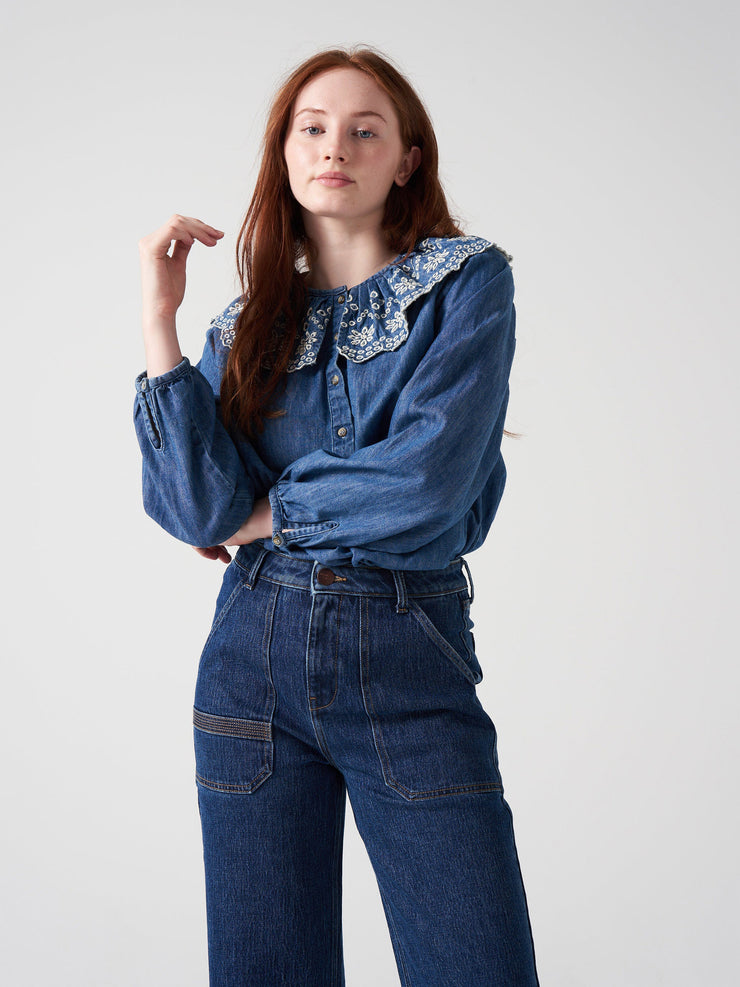Featuring a statement collar, this versatile, denim Seventy + Mochi blouse is the perfect transitional piece. Layer under jumpers and jackets, or on its own. Collagerie.com