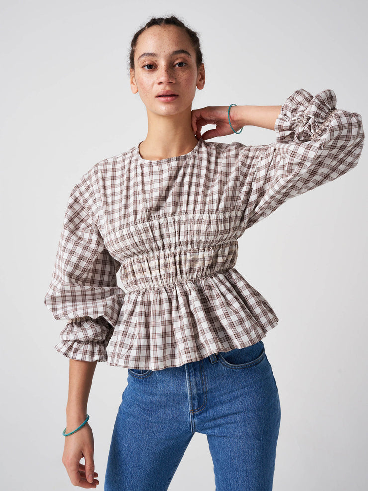 Easy to wear, light, artisanal sand check Seventy + Mochi top with rouching detail in contrast stitch colour and ballooned sleeves. A perfect fall piece. Collagerie.com