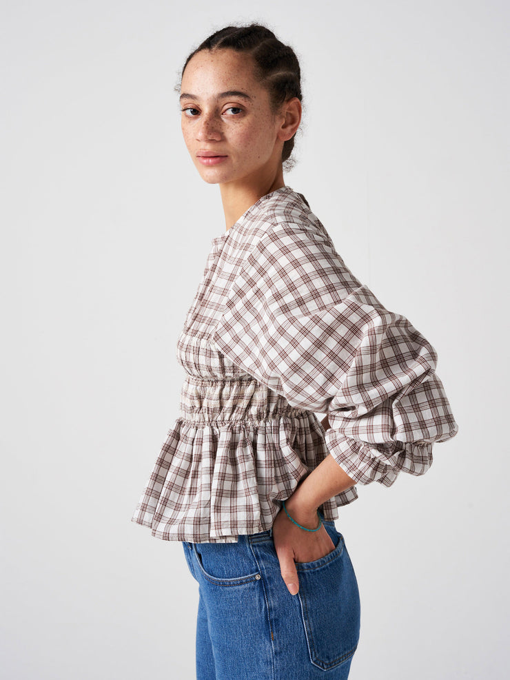Easy to wear, light, artisanal sand check Seventy + Mochi top with rouching detail in contrast stitch colour and ballooned sleeves. A perfect fall piece. Collagerie.com