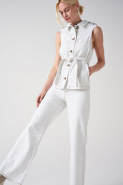 Seventy + Mochi's modern take on the 70s trend: this sleeveless white denim jacket. This is your must-have layering transitional piece. Collagerie.com