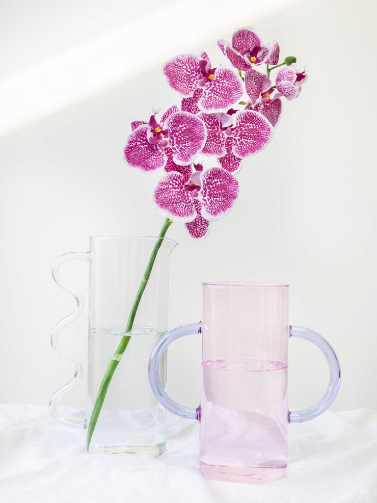 Double the fun. Spruce up your homeware collection with this borosilicate glass vase that comes in pink/purple or clear glass. Collagerie.com