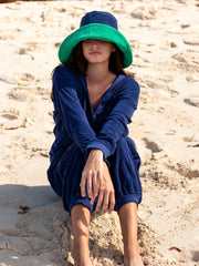 Reversible green and navy towelling bucket hat by Rae Feather. Great addition to your Summer wardrobe and made out of towelling cotton | Collagerie.com