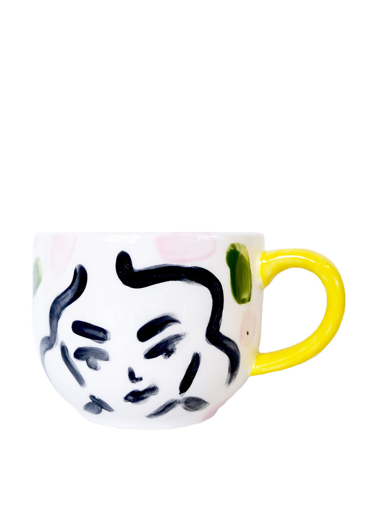 Small yellow handle mug
