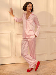 Pink silk pyjamas with red piping