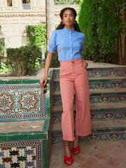 Red and white scalloped gingham cropped trousers by Yolke. Made from cotton and sit high on the waist with relaxed wide legs | Collagerie.com