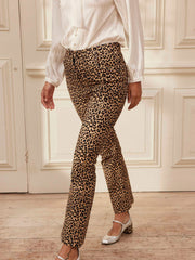 These slim cut and gently flared leopard print cotton corduroy Yolke trousers are flattering and versatile. The hero statement day-to-night piece. Collagerie.com