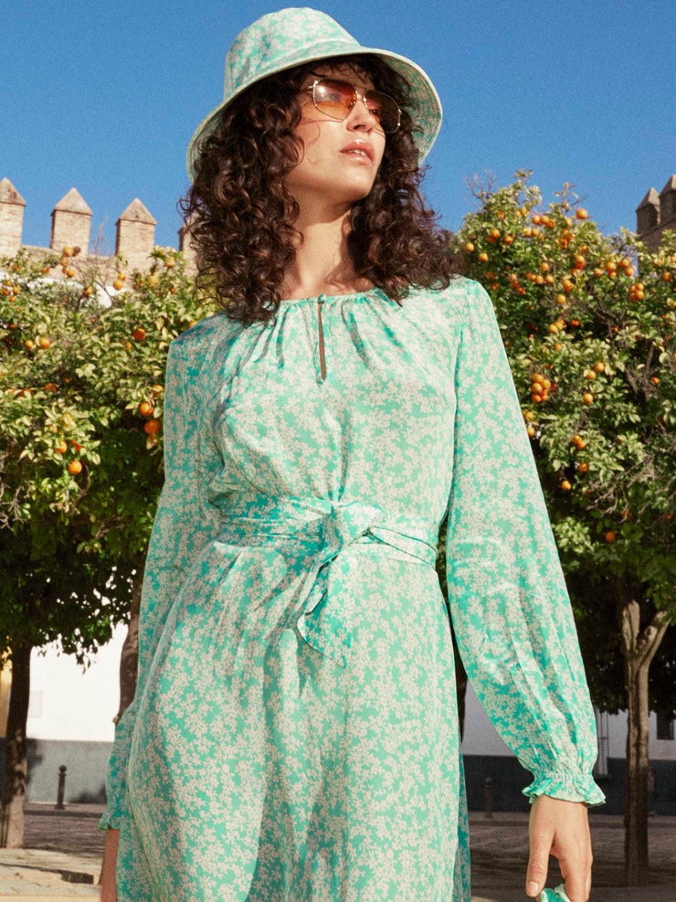 Green and white floral print paloma midi dress by Yolke. An optional cinched in waist with belt and gently flared sleeves. Perfect summer dress | Collagerie.com