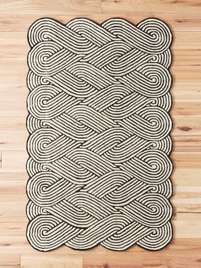 Anthropologie Hand-tufted black and white swirl rug at Collagerie