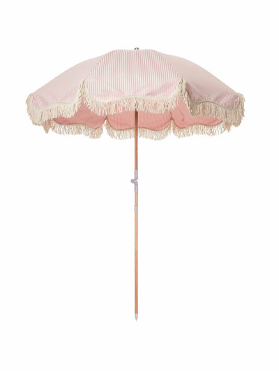 Business & Pleasure Co. Pink and white striped beach umbrella at Collagerie