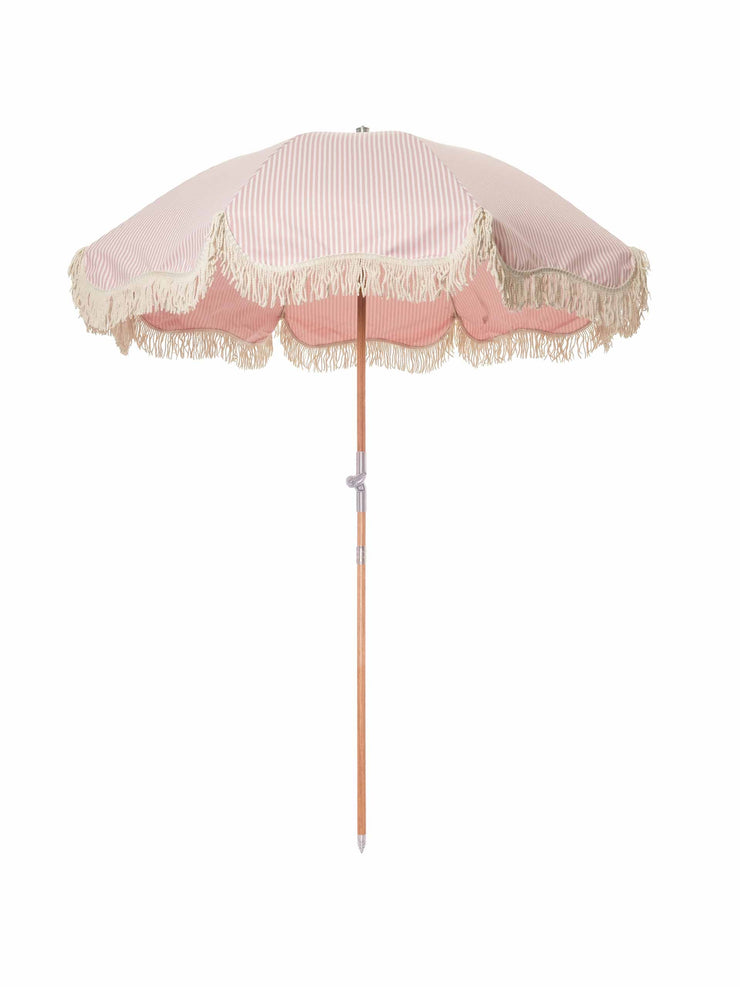 Pink and white striped beach umbrella