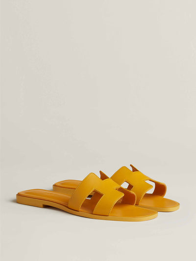 Hermès Orange calfskin sandals at Collagerie