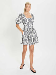 Dominique navy and white broderie anglaise mini dress by Borgo de Nor. Black and white print mini dress with puffed sleeves for the evening | Collagerie.com