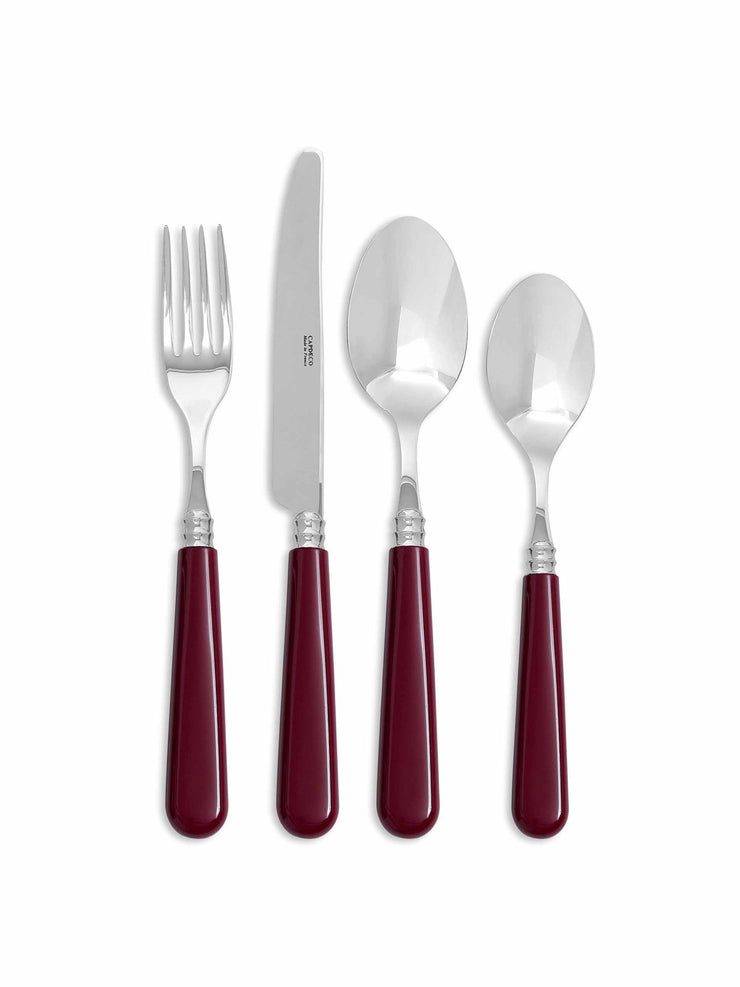 A timeless set of Maison Margaux cutlery made with stainless steel hardware and burgundy red handles. A delightful essential to your next tablescape. Collagerie.com