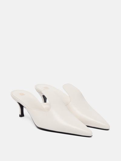 Totême White leather mules at Collagerie