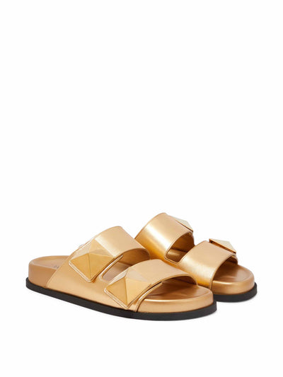 Valentino Garavani Gold leather studded sandals at Collagerie