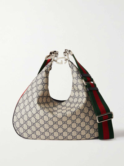 Gucci Large textured leather-trimmed shoulder bag at Collagerie