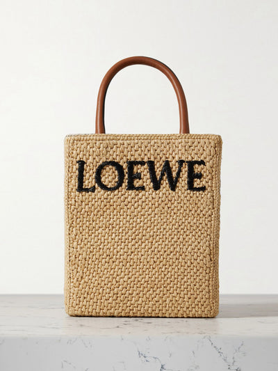 Loewe Leather trimmed raffia tote at Collagerie