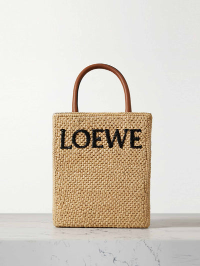 Loewe Leather trimmed raffia tote at Collagerie