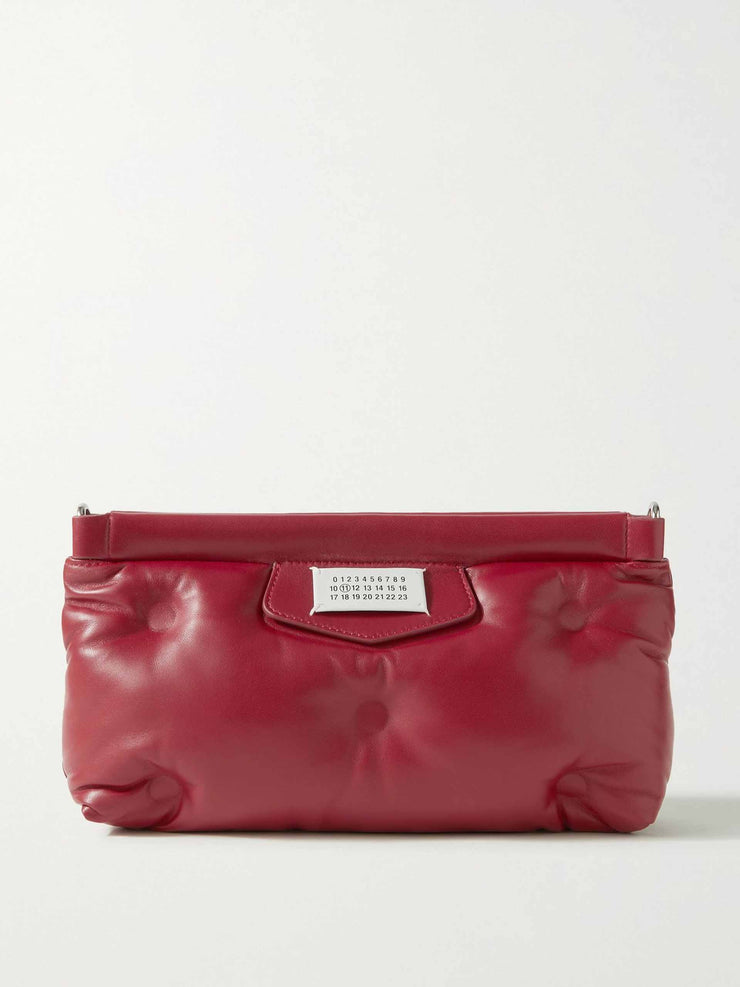 Red quilted leather clutch bag