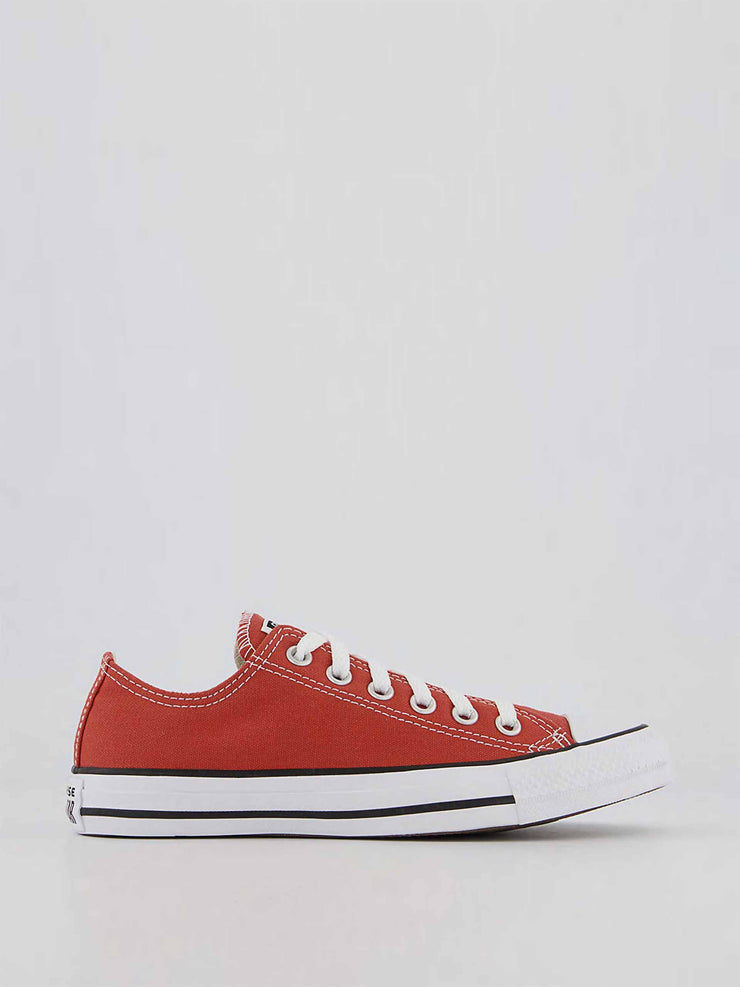 Red low top trainers