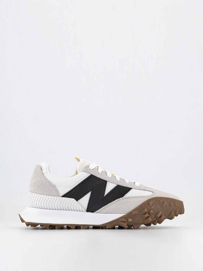 New Balance White and black unisex trainers at Collagerie