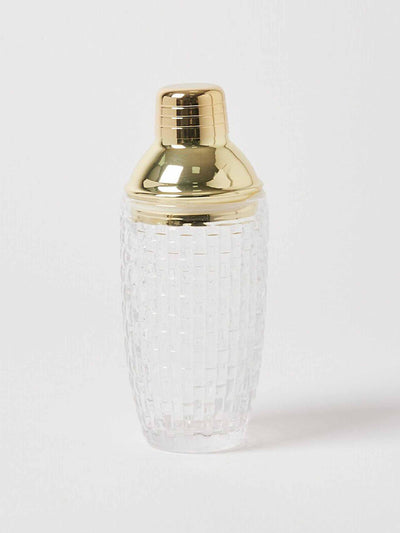 Oliver Bonas Gold metal and glass cocktail shaker at Collagerie