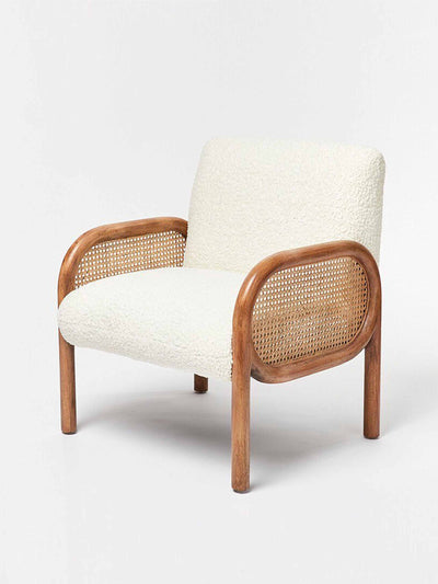 Oliver Bonas Loha faux sheepskin boucle & rattan armchair at Collagerie