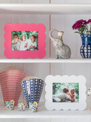 Addison Ross pink scalloped photo frame in high gloss lacquer. Clean with a soft dry cloth. Overall size is 23 x 28cm, suitable to fit a 5 x 7" in photo | Collagerie.com