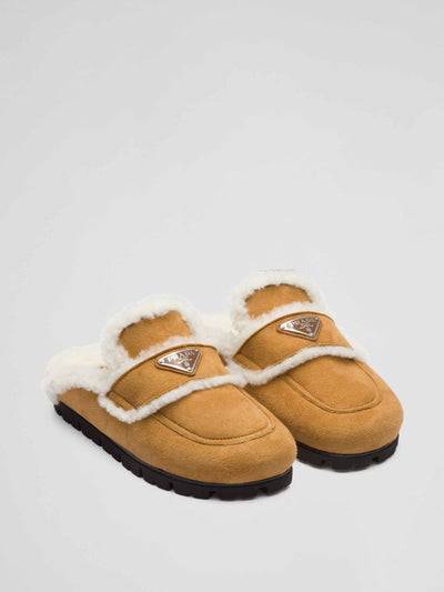 Prada Shearling slippers at Collagerie
