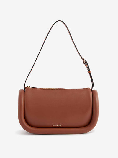 Jw Anderson Bumper baguette logo embossed leather shoulder bag at Collagerie