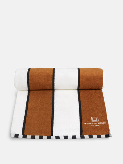 Soho Home Brown and white striped pool towel at Collagerie