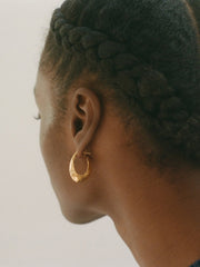 Gold surreal hoop earrings