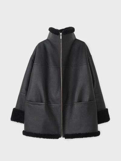 Toteme Black shearling jacket at Collagerie