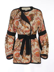 A quilted Anna Mason jacket inspired by an antique piece of fabric printed on both silk and cotton to retain an antique look. Collagerie.com