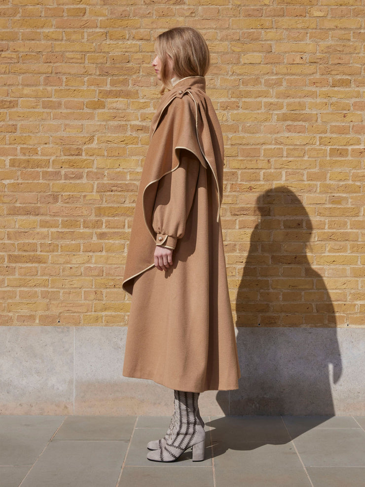 Dress up any look with this vintage inspired Anna Mason coat made from luxurious fine Loro Piana Camelhair Wool. Collagerie.com