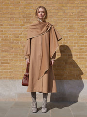 Dress up any look with this vintage inspired Anna Mason coat made from luxurious fine Loro Piana Camelhair Wool. Collagerie.com