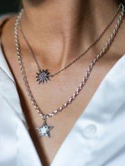 Diamond and white gold starburst necklace
